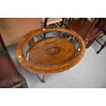 An Edwardian mahogany and inlaid oval coffee table, with inlay decoration