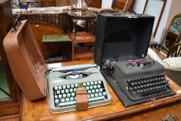 Two vintage typewriters including Hermes baby and Imperial with circular letters