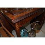 A 19th Century mahogany fold over tea table having shell and line inlay detailing