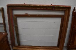 An oversized gilt picture or mirror frame