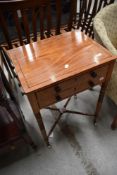 An interesting and unusual 19th Century satinwood centre occasional table having two long drawers on