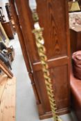 A vintage brass standard lamp having twist column