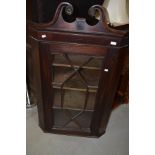 A 19th Century mahogany corner display cabinet having astral glazed door and line inlay decoration