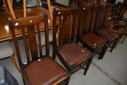 A set of four early 20th Century rail back dining chairs