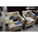 A pair of traditional armchairs having patchwork upholstery