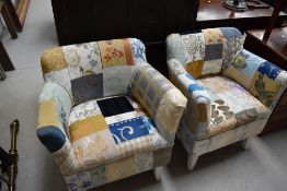 A pair of traditional armchairs having patchwork upholstery