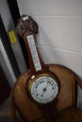 An early 20th Century oak cased aneroid barometer