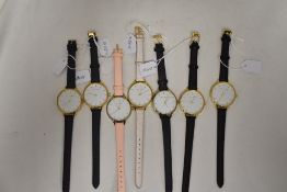 Seven Lily Stone circular faced watches