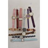 Ten bright coloured ladies fashion watches.