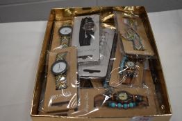 A selection of fashion watches all new in packaging and having beaded straps.