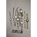 Ten ladies gold tone watches, one having black face and one Sekonda included.