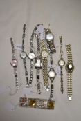 Ten ladies gold tone watches, one having black face and one Sekonda included.