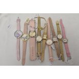 Ten ladies/girls watches with coloured straps.