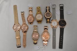 Nine mens watches including rose gold tones.