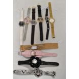 Ten ladies watches, various brands including Playboy, Armani, Oasis and more.