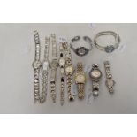 Ten ladies silver tone watches, one having black face, two with pink.