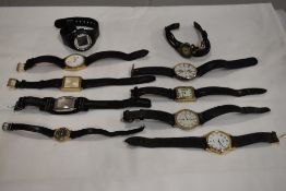 10 wrist watches all in black tones.