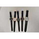 Five mens watches all having black straps including Swatch.