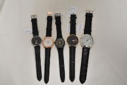 Five mens watches all having black straps including Swatch.