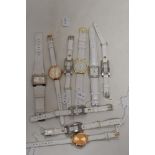 Ten ladies/girls fashion watches, all having white straps.