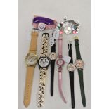 eight ladies/girls fashion watches including Mickey mouse and teddy bear.