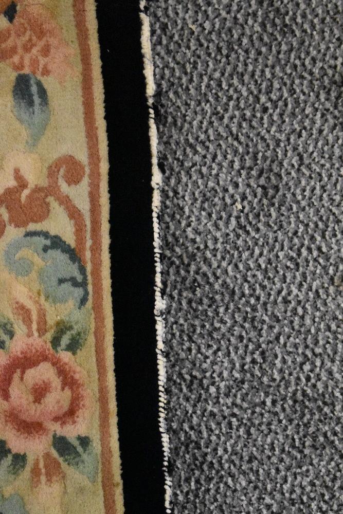 A modern Chinese style carpet runner in beige and black ground with a floral and fruit border - Image 5 of 5