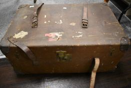 An early 20th century luggage case with canvas body and leather straps