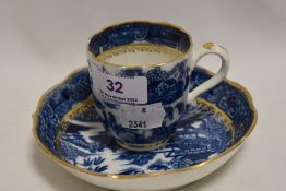 An 18th century Caughley blue and white ware pattern tea cup and saucer, bearing S mark to base