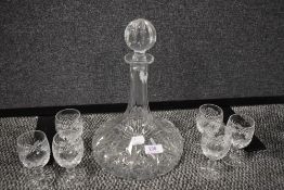 A fine clear cut crystal glass decanter and brandy glass set