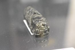 A Chinese spinach jade pendant carved in the form of a Cicada insect