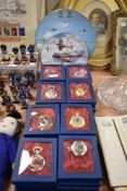 A selection of modern collectable pocket watches in boxes with two RAF display plates