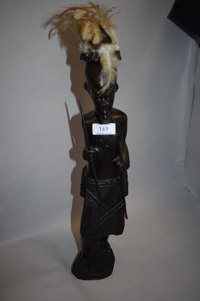 A carved wood African tribal figurine. - Image 2 of 3