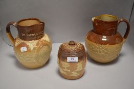 Three pieces of Doulton Lambeth including Queen Victoria 1837 - 1897 jug, tobacco jar and similar