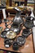A selection of antique pewter wares including trophy style cup, Benedict pewter jug and Britannia