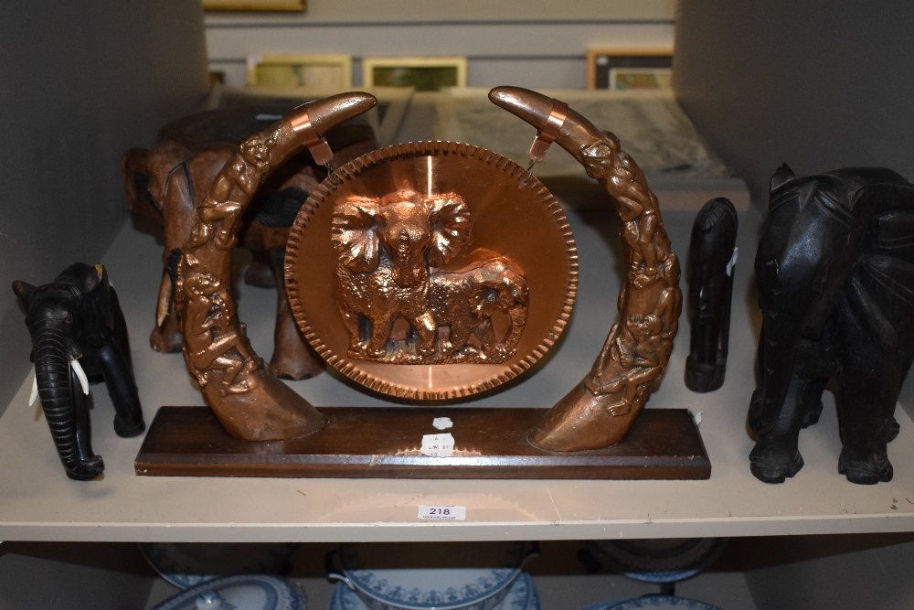 A selection of Elephant theme items including carved wood figures, foot stool and gong ornament