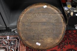 An early 20th century Groves and Whitnall Salford wooden brewery barrel lid