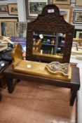 An early 20th century carved oak framed mirror with decoupage book shelf and a W Dowler oak step