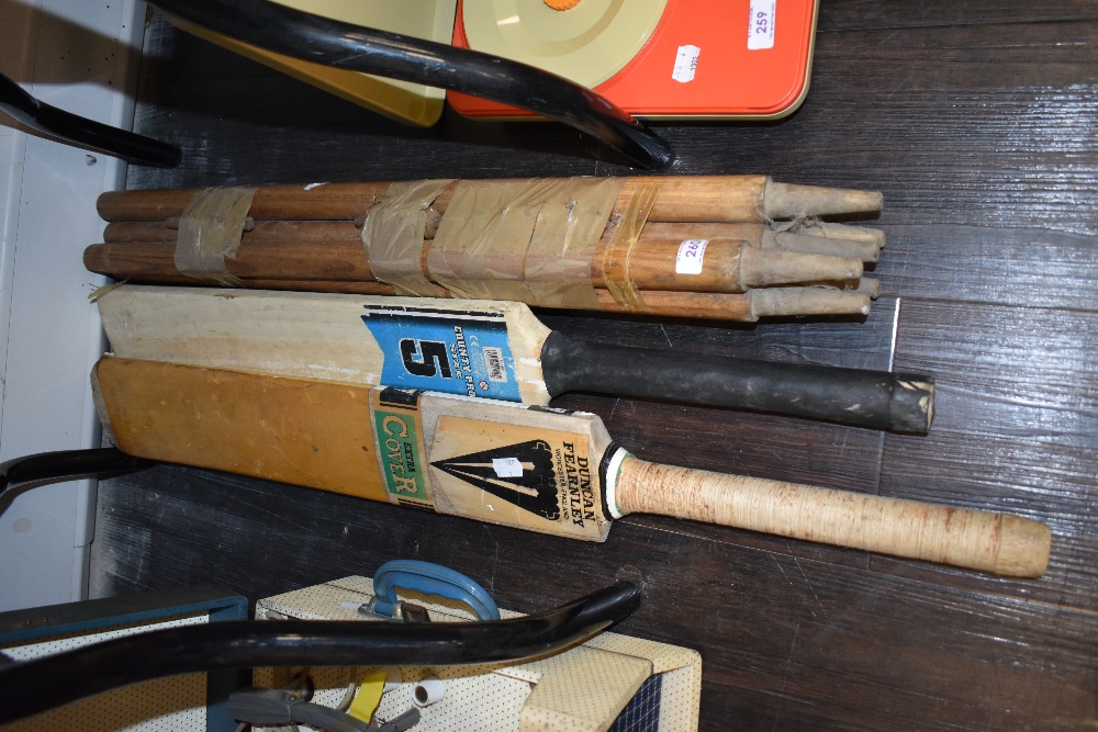 A selection of cricket bats including County Pro and Duncan Fearnley