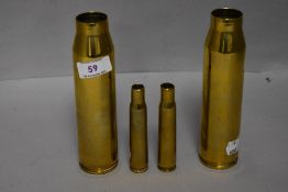 Four vintage military brass bammunition shell cases