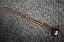 An early 20th century wooden treen club possibly game related