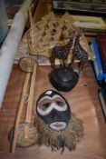 A carved wooden lidded bowl, a pair of Giraffes, a tribal mask and similar.