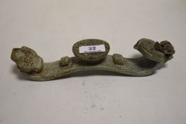 A Chinese soap stone carved candle stand or similar with carved details