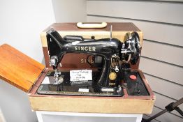 A 20th century Singer Sewing machine 99k with fitted case and accessories