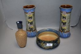Four pieces of antique Royal Doulton including a pair of Ethel Beard vase, Rosina Brown vase and