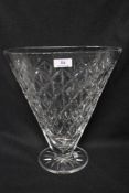 A modern clear cut crystal glass V shaped vase