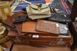 A selection of 20th century leather wallets and a small size briefcase