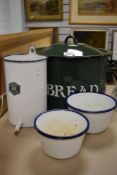 A selection of enamel kitchen wares including bread bin, dishes and dispensor