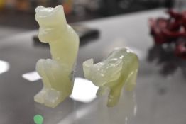 Two pale jade stone carved figures of an Ox and a Monkey