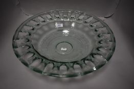 A mid century large studio art glass bowl having a pierced rim design