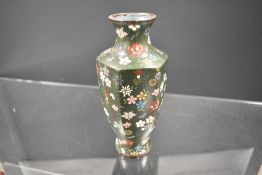 A 19th century Chinese cloisonne vase having a deep green base with millefiori pattern